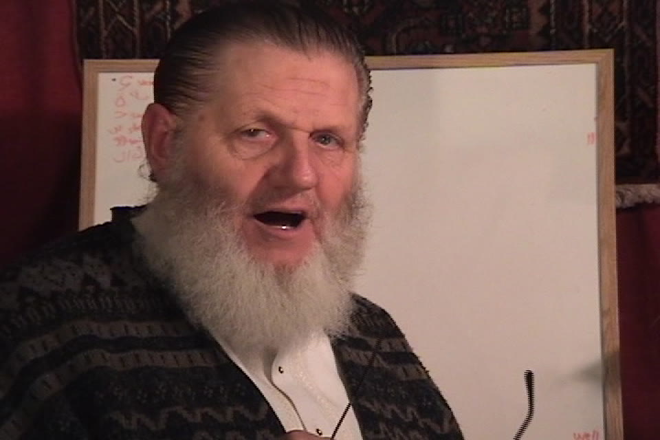 Yusuf Estes introducing a letter sound on camera